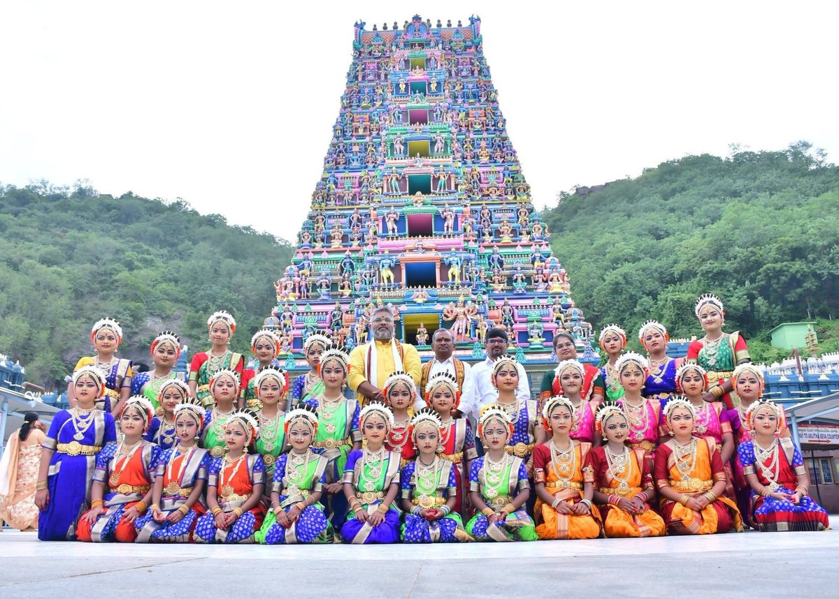 Kuchipudi dancers with Talikota Hari Krishna before the temple gopuram at the Shravana Maasa Nrityotsavam